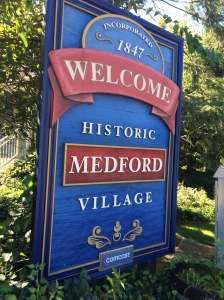 Sign that reads Welcome to Historic Medford Village